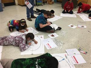 students working on their "go bag" pillowcases